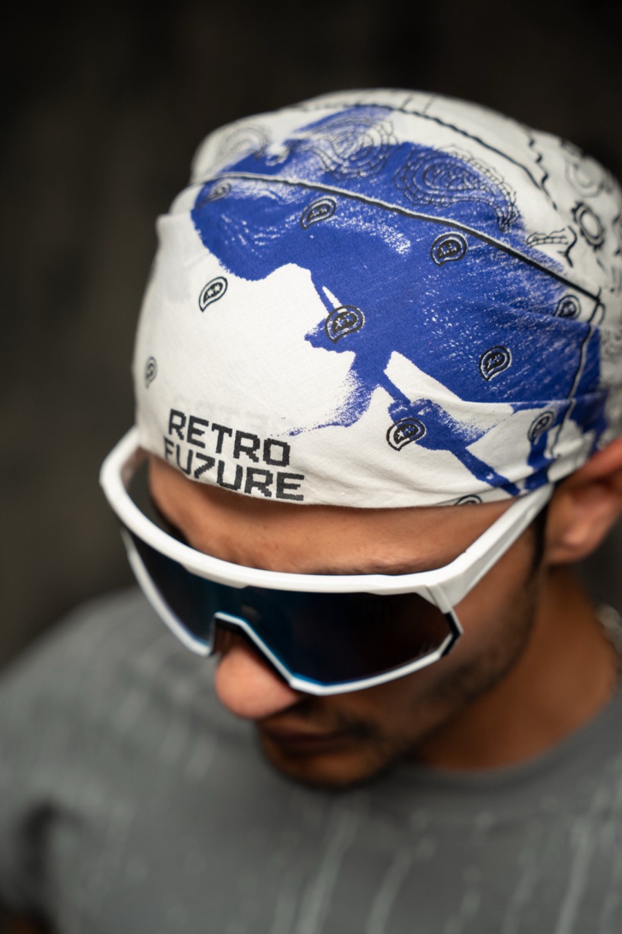 Overhead crop of a white RETRO FUTURE bandana and white wraparound shades from the RF6 campaign